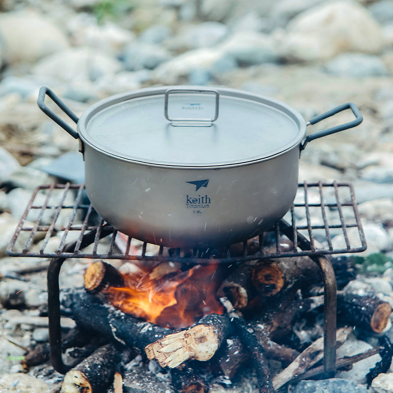 Keith Titanium Ti6015 1.8 L pot with lid cooking over an open campfire