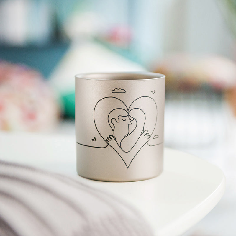 Single Keith Titanium Jonathan Calugi collectible mug on a soft indoor tabletop