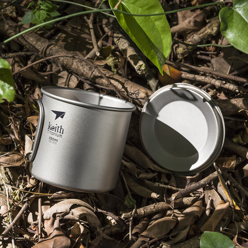 Keith Titanium Ti3240 350 ml single-wall mug with the lid removed on the forest floor