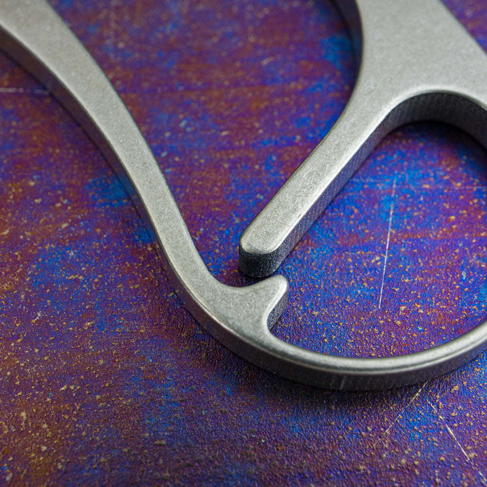 Close-up of the lower hook and bottle opener on the Keith Titanium Ti1155 carabiner