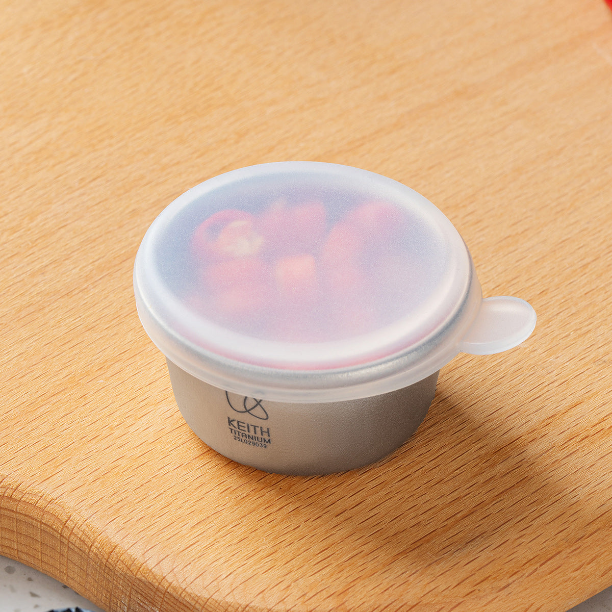 KEITH Ti1161 titanium mini container with a translucent silicone lid and sliced chili inside