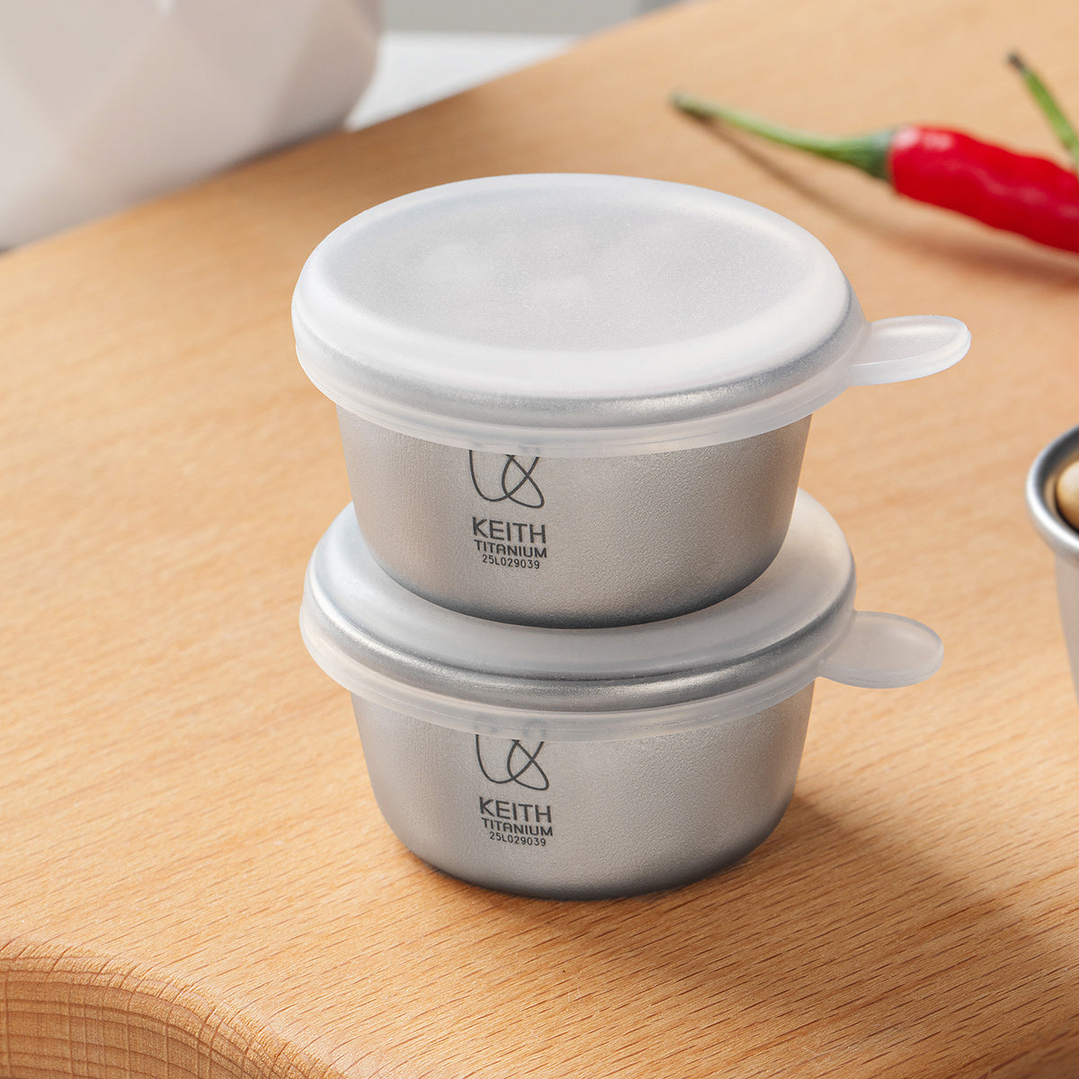 Two stacked KEITH Ti1161 titanium mini containers with silicone lids