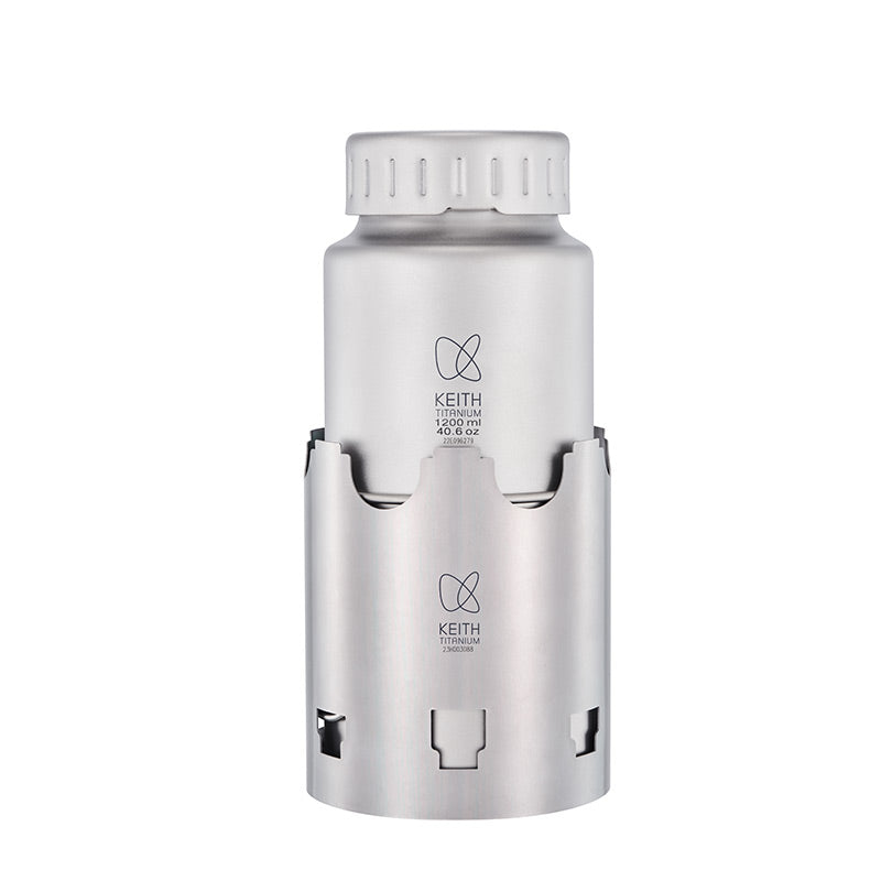 Keith Titanium Ti3070 nesting camp set with bottle fitted inside the wood stove sleeve on a white background