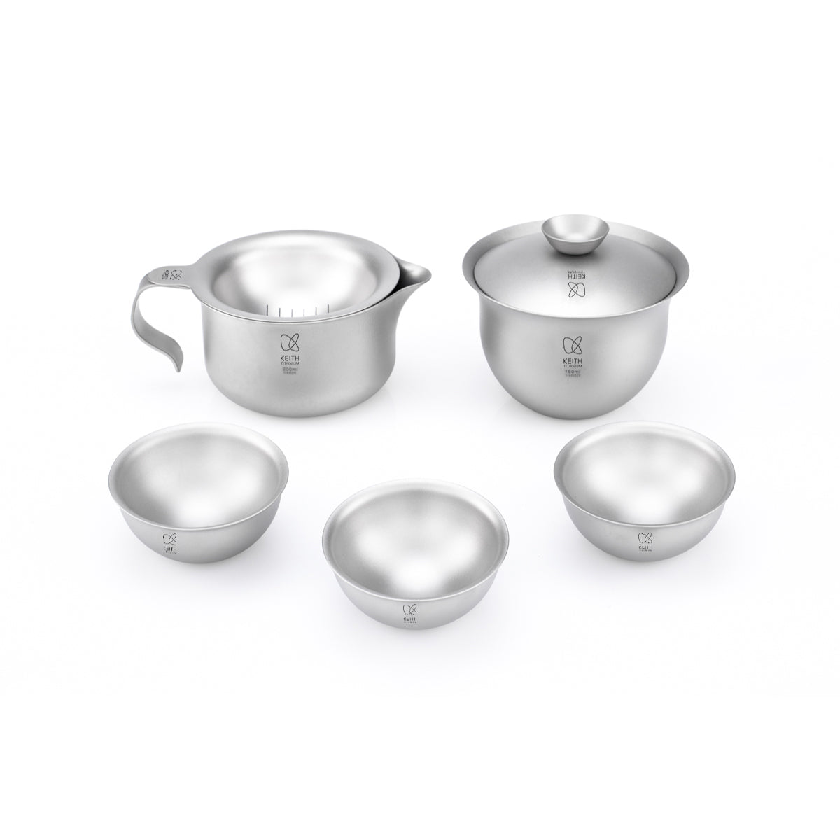 Keith Titanium Ti3910 tea set with a handled pitcher, lidded pot, and three cups on a white background