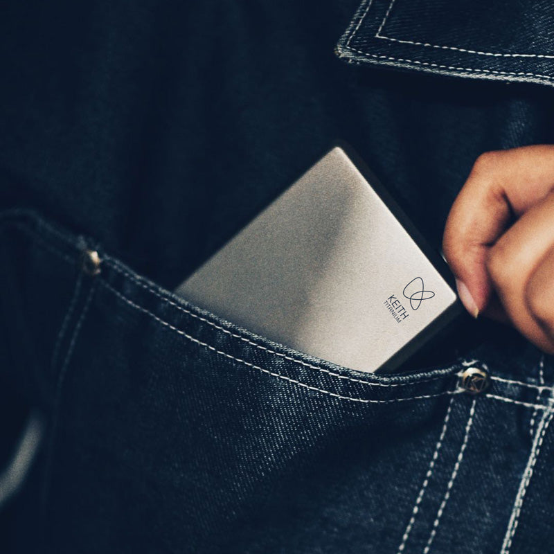 Keith Titanium Ti9306 pocket flask slipping into a jeans pocket