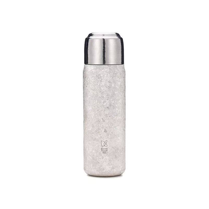 Front view of KEITH Ti3107 430 mL silver titanium vacuum-insulated bottle on a white background