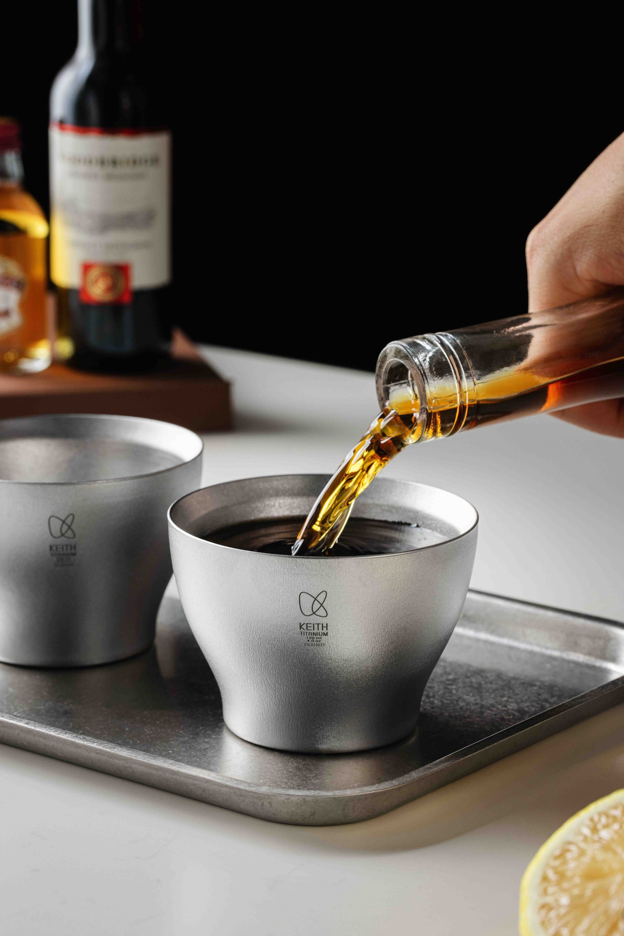 Pouring a drink into the Keith Titanium Ti3909 Huaiyue cup